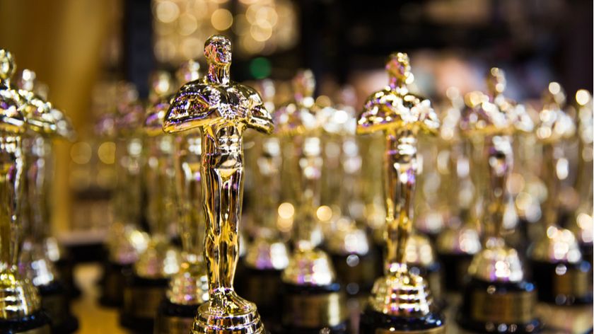 Oscars statuettes standing in a row