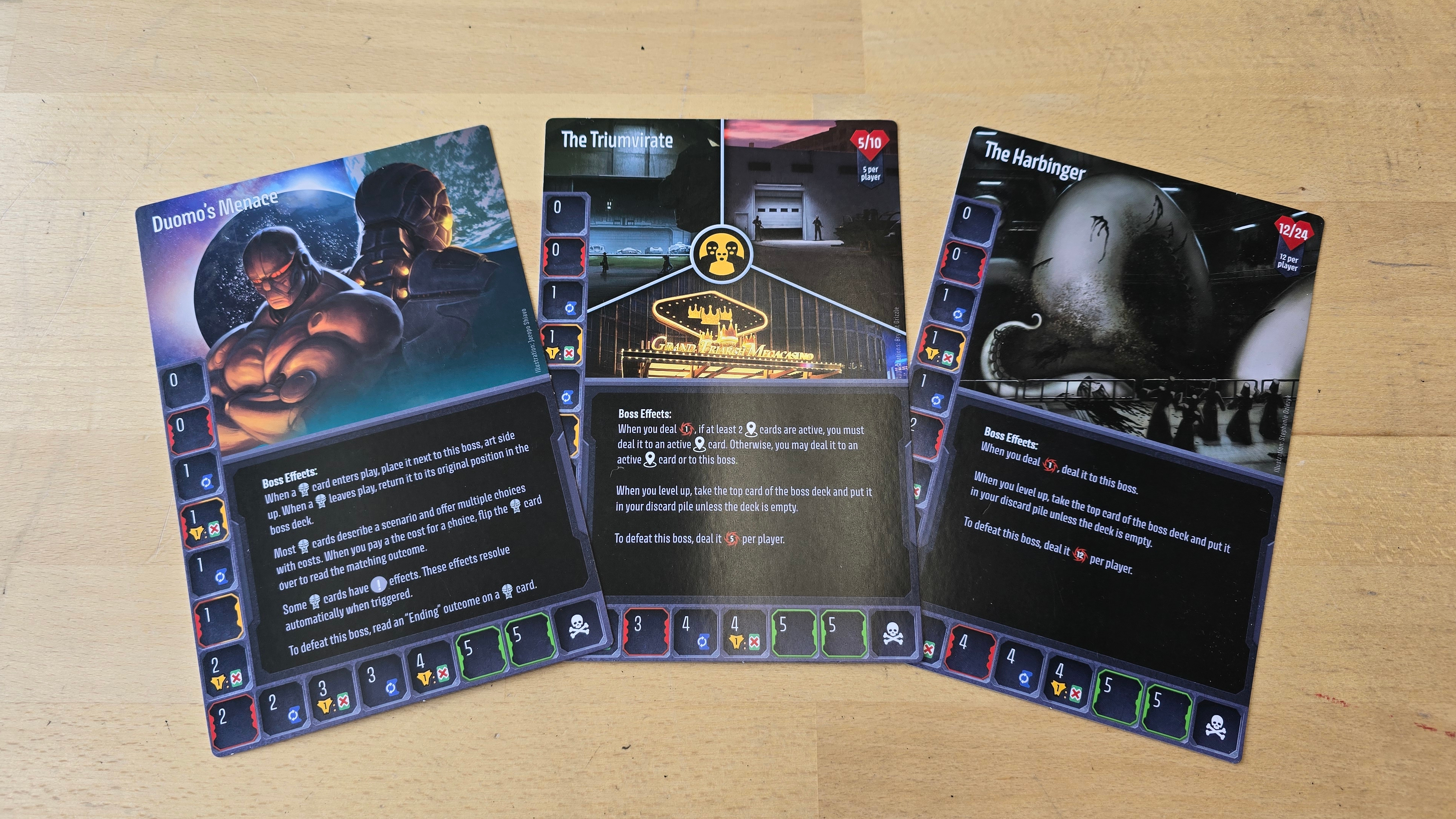 A trio of Unstoppable cards laid out on a wooden surface