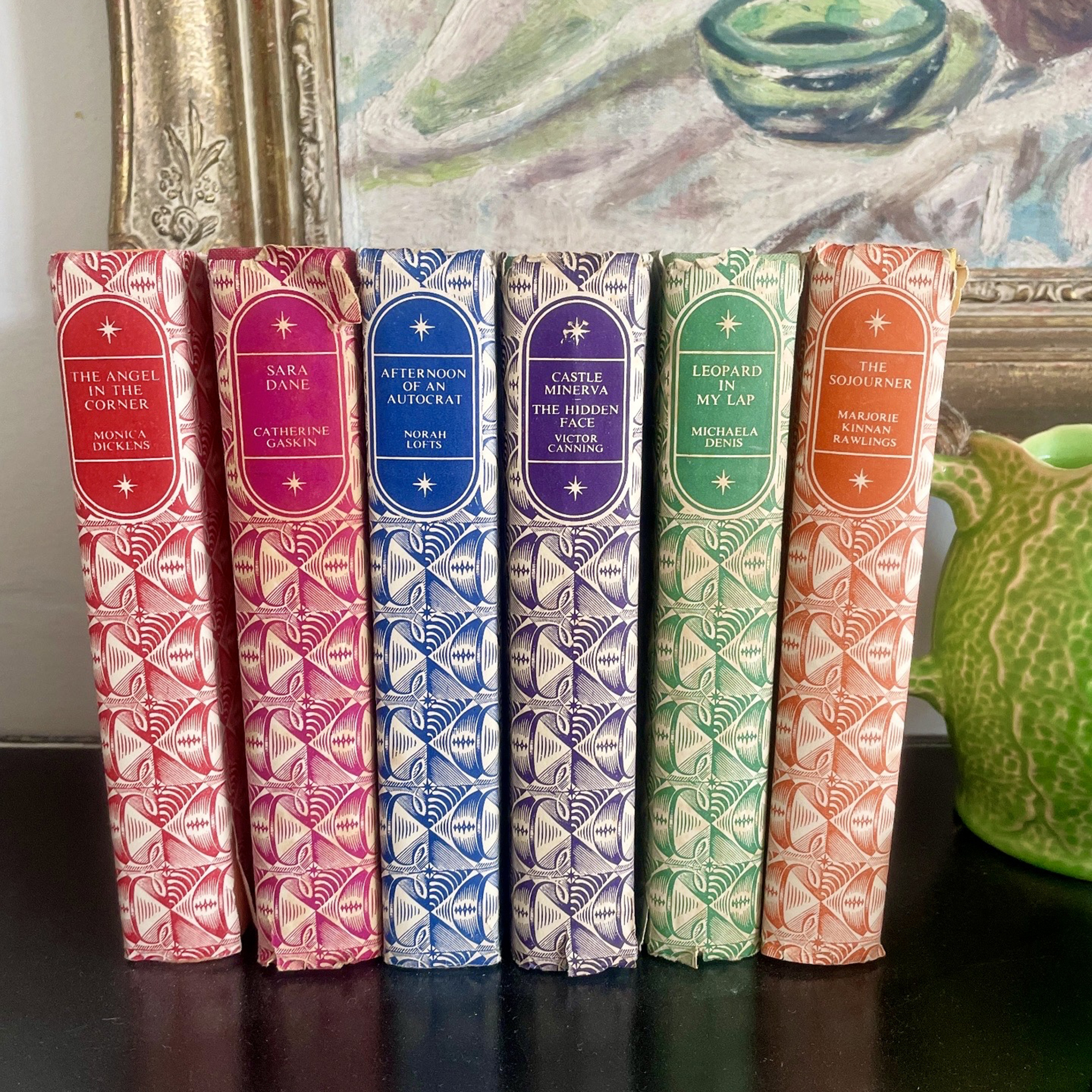 coloured books lined up on a shelf