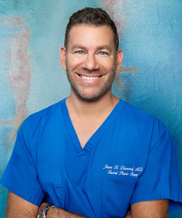 Dr. Jason Diamond in blue scrubs
