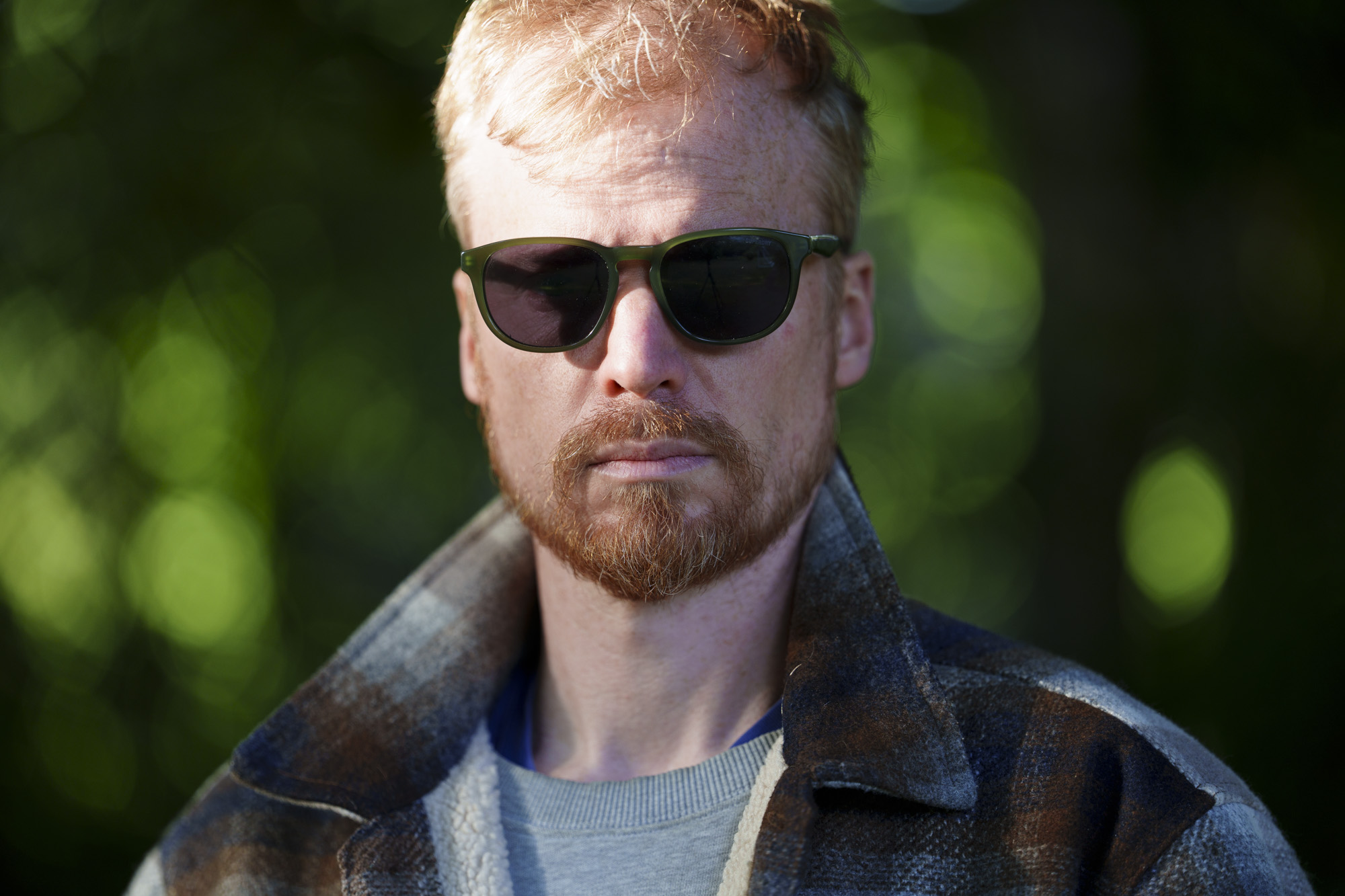 Head-and-shoulder portrait of a man in sunglasses and jacket, taken with the Sony FE 50-150mm F2 GM lens, taken with the Sony FE 50-150mm F2 GM lens