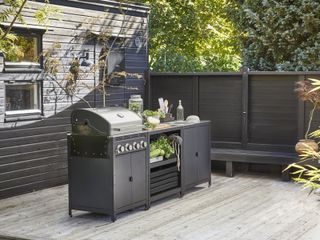 A barbecue grill on a deck