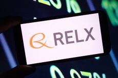 Relx logo on mobile phone with data in the background