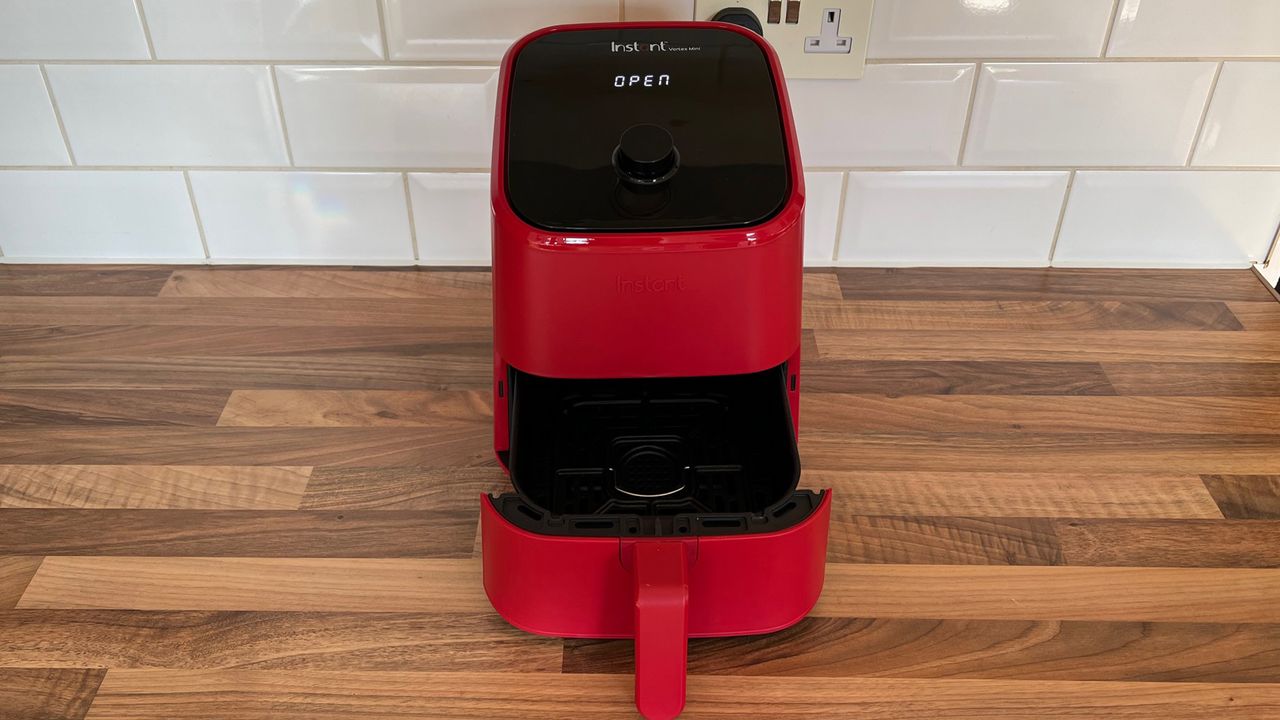 The Instant Vortex Mini with the basket removed on a kitchen countertop