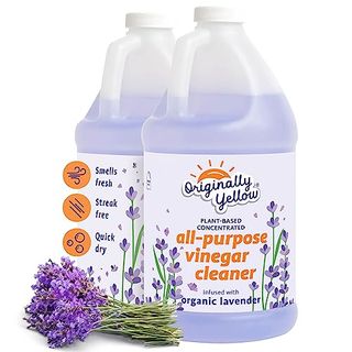 Two large 64 fl oz plastic bottles with handle and purple liquid visible inside and a bunch of lavender in promo shot