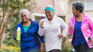 Three senior women running together.