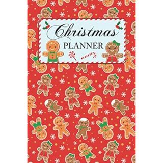 A red notebook with gingerbread on the front, the words 'Christmas planner' in decorative writing