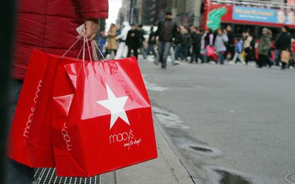 A shopper holds a Macy's bag in NYC