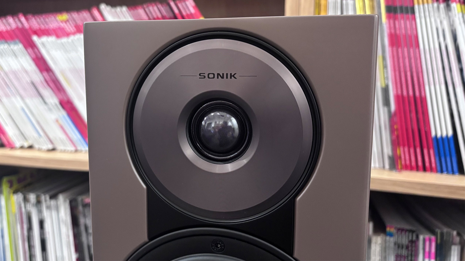 Dali Sonik 1 standmount speakers in front of bookcase, detail of tweeter
