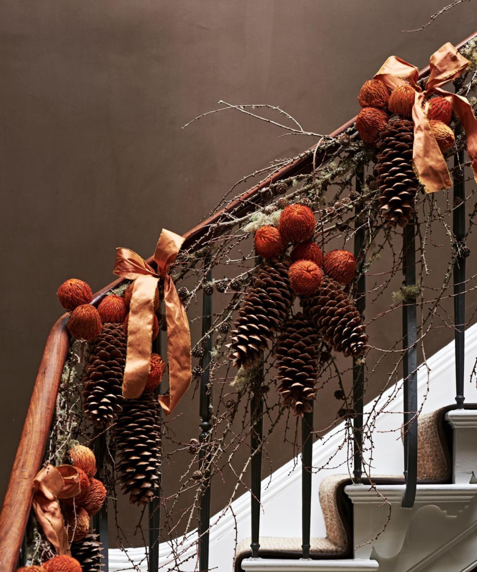Orange foliage garland on staircase