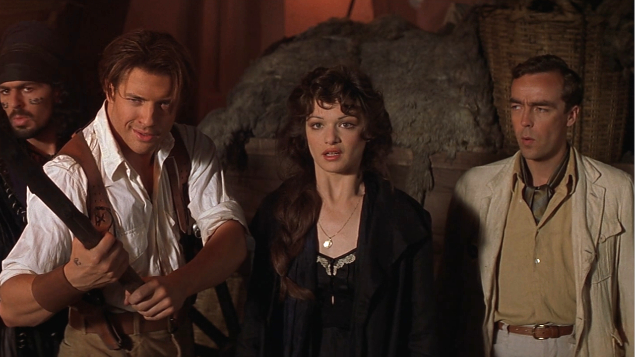 Rachel Weisz in conversation while Oded Fehr, Brendan Fraser, and John Hannah flank her in The Mummy,