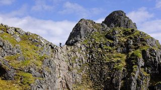 solo backpacking: hiker on Aonach Eagach ridge