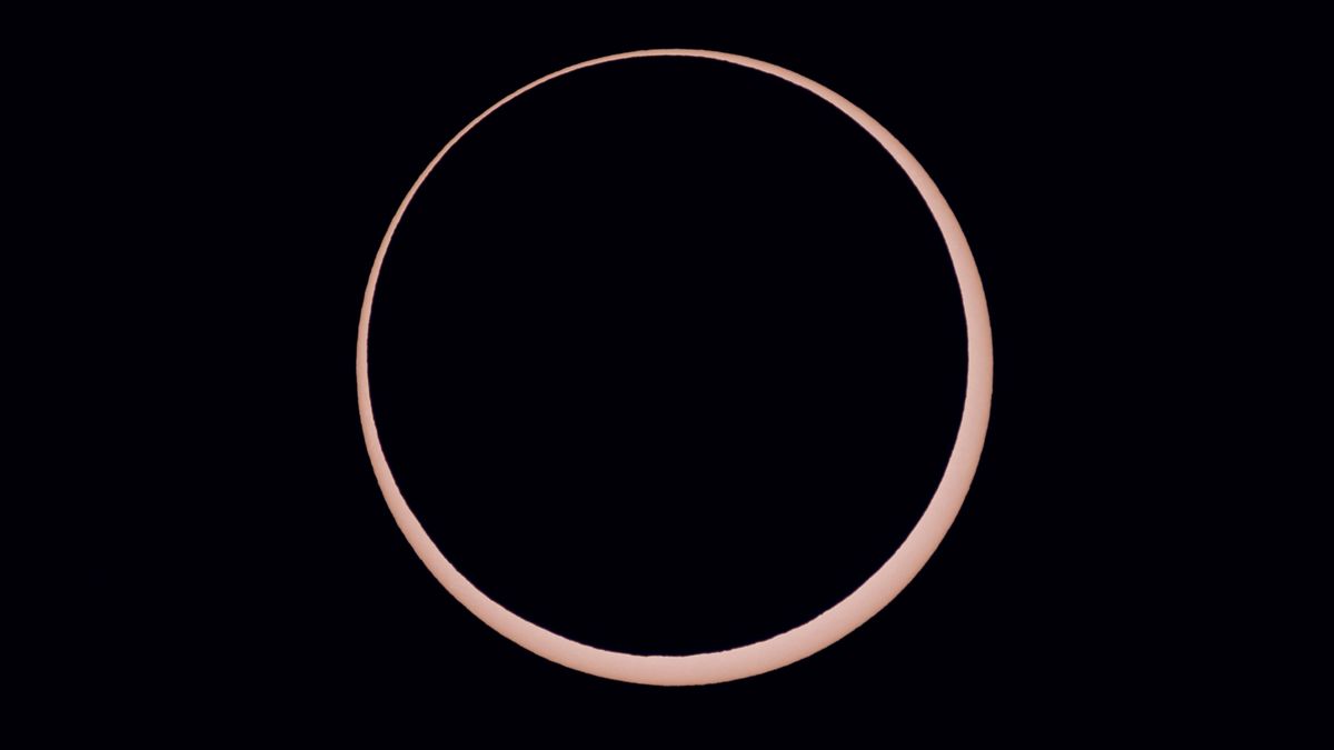 a ring of light around a black orb - this is an annular solar eclipse close up.