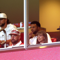taylor swift and travis kelce in a football stadium box