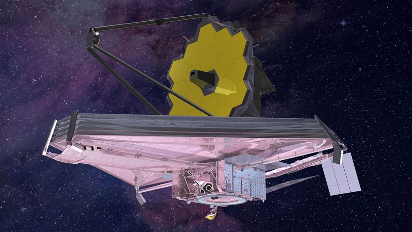 An artist&#039;s impression of the James Webb Space Telescope flying through space against a star strewn deep blue sky featuring nebula clouds.