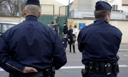 French police stand guard outside a Jewish school in Villeurbanne: The country's religious schools and buildings have beefed up security after a deadly attack at a Jewish school Monday.