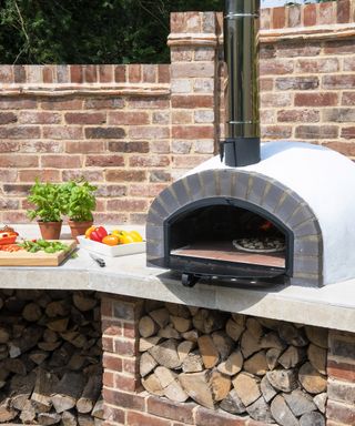 Pizza oven in a brick outdoor kitchen