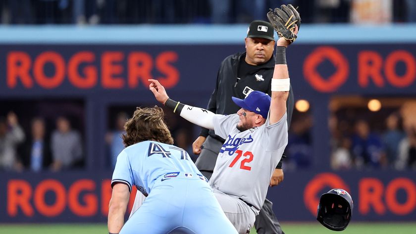 The Los Angeles Dodgers&#039; Miguel Rojas forces out the Toronto Blue Jays&#039; Addison Barger in the 2025 World Series at Rogers Center