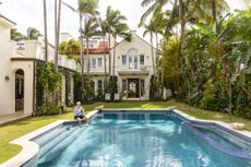 Man sitting by a pool