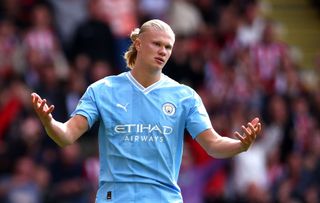 Erling Haaland of Manchester City reacts after missing a penalty for his team during the Premier League match between Sheffield United and Manchester City at Bramall Lane on August 27, 2023 in Sheffield, England. (Photo by Chloe Knott - Danehouse/Getty Images)