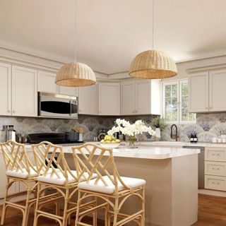 Two rattan light fixtures hanging above a kitchen island