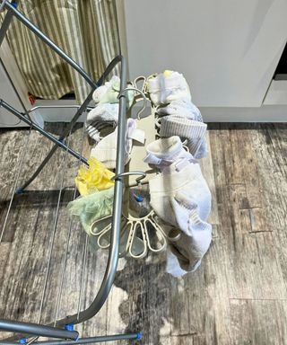 The Petal hanging off one airer rail filled with socks