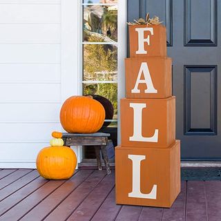 Porch with pumpkins and orange decorative fall sign