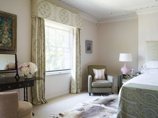 bedroom with fur rug and drapes
