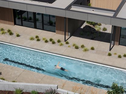 Image of an Oregon house, the Bend Hideaway, a linear modern home among trees and open to nature