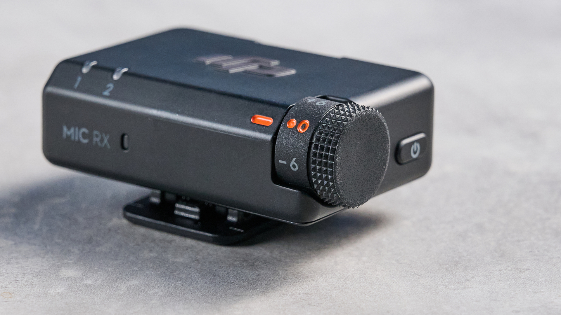 the dji mic mini 2 for camera and smartphone conent creators photographed against the blue tom's guide background