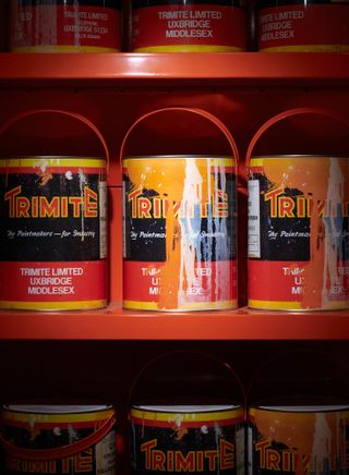 Orange paint cans by Ben Kelly