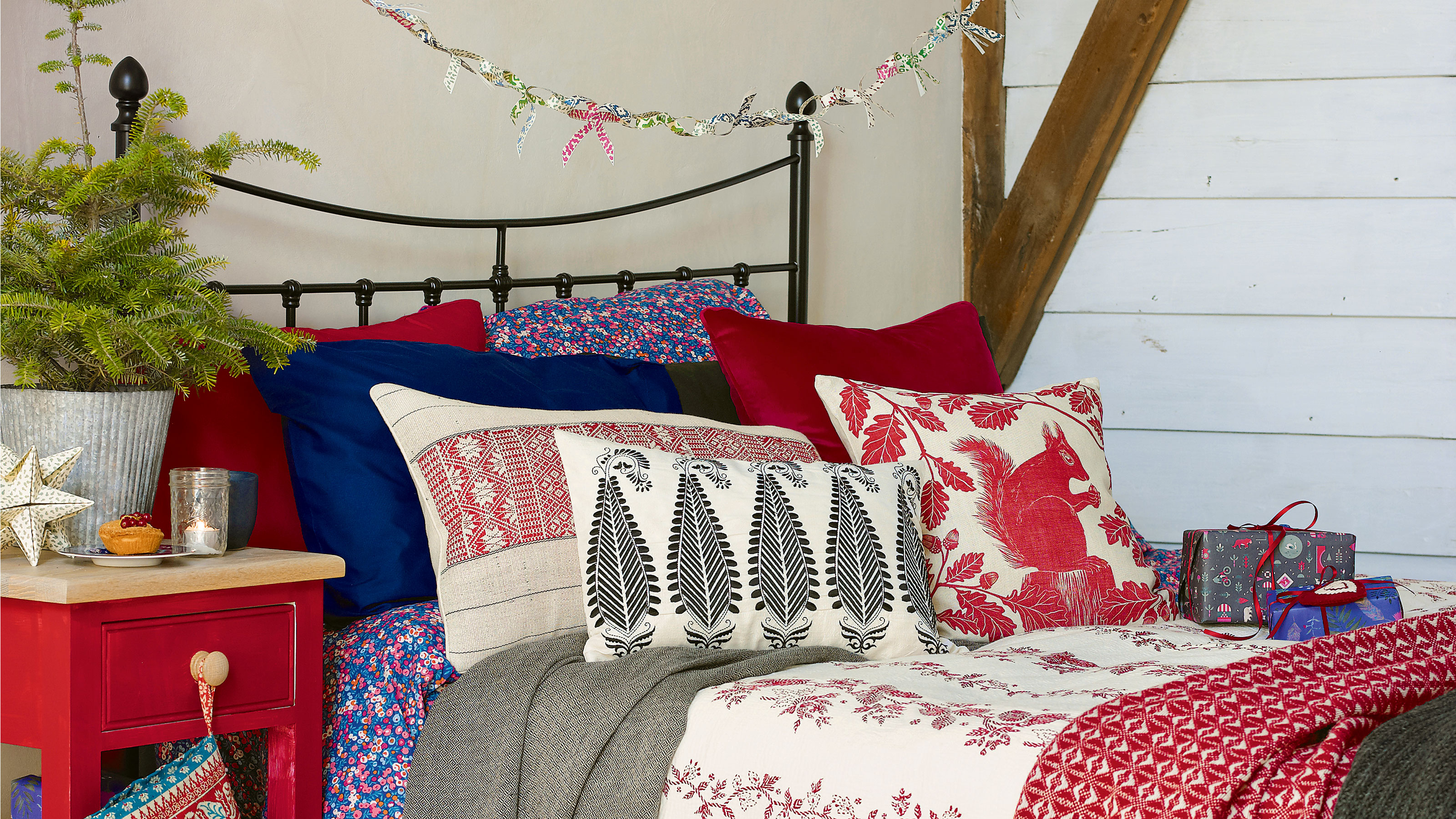 White guest room with block print festive bedding