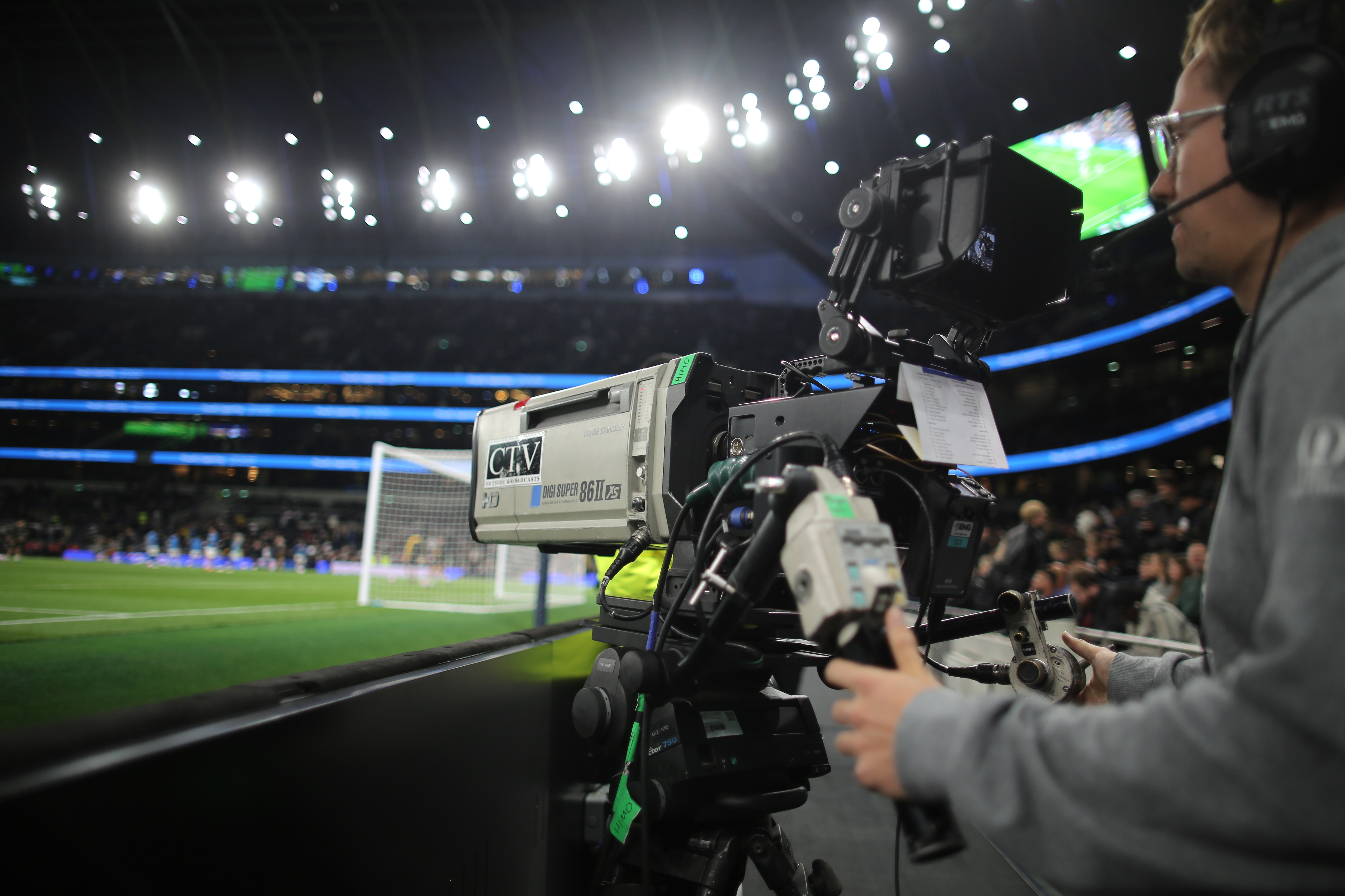 Tottenham Hotspur Stadium cameraman pans to the action