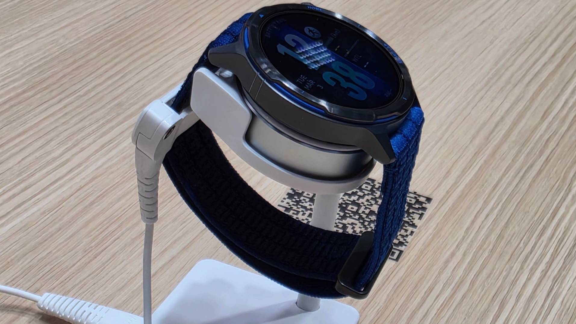 The Huawei Watch GT Runner 2 on a stand.