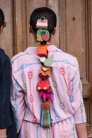 Jyoti Babani, wears colorful mini bags in a ponytail, outside Hermes, during the Womenswear Fall/Winter 2024/2025 as part of Paris Fashion Week on March 02, 2024 in Paris, France.