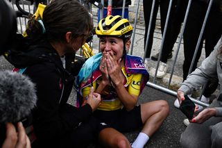 CanyonSRAM Racing teams Polish rider Katarzyna Niewiadoma reacts as she celebrates after crossing the finish line and winning the third edition of the Womens Tour de France cycling race after the 8th and last stage of the Tour de France a 1499 km between Le Grand Bornand and the Alpe dHuez in southeastern France on August 18 2024 Photo by JULIEN DE ROSA AFP Photo by JULIEN DE ROSAAFP via Getty Images