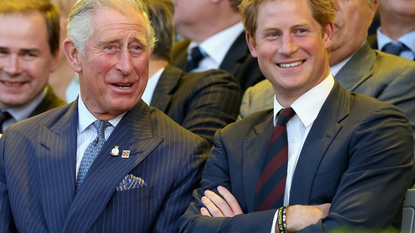 Prince Charles, Prince of Wales and Prince Harry laugh during the Invictus Games Opening Ceremony on September 10, 2014 in London, England. 