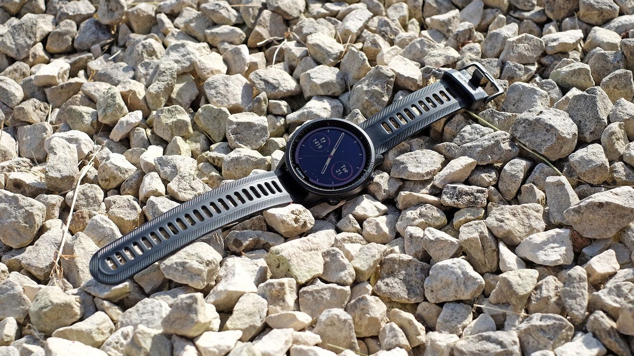 Garmin Forerunner 955 laid against rocky background