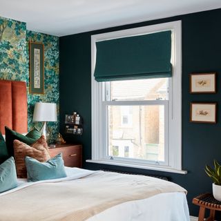 Dark painted bedroom with window and matching dark blue blinds