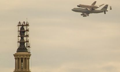 The Discovery space shuttle hitches a ride aboard a 747 airplane to its final home at the Smithsonian National Air and Space Museum in Washington, D.C.