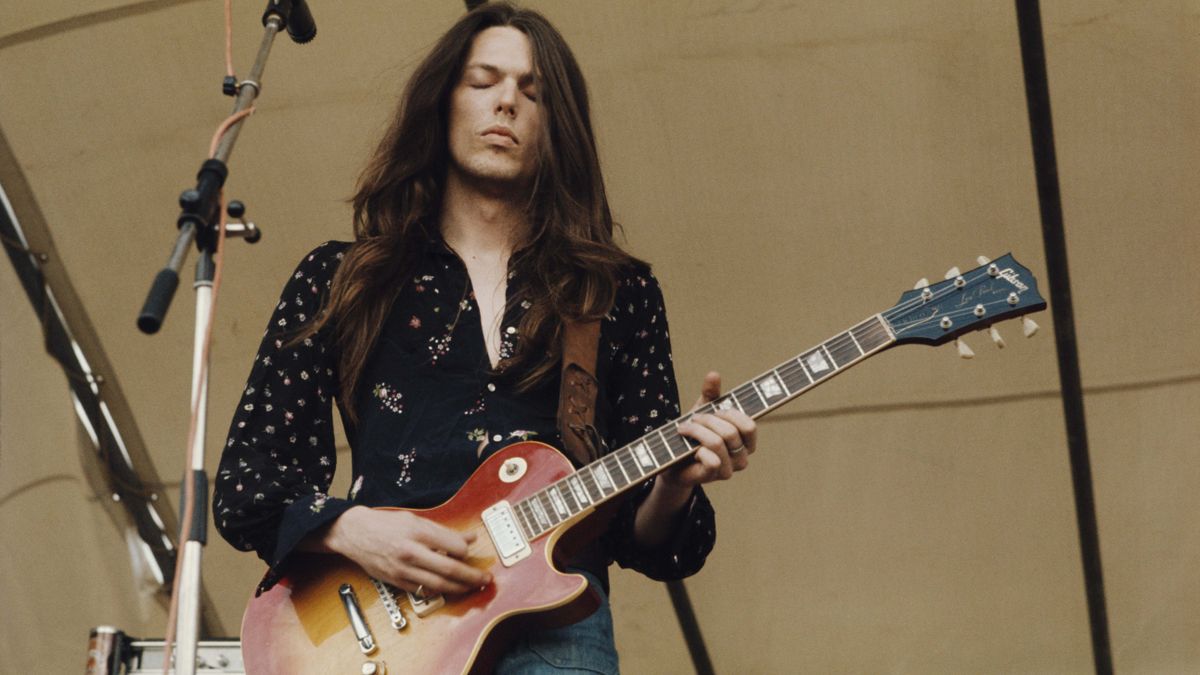 American guitarist Scott Gorham performs playing a Gibson Les Paul guitar on stage with Irish rock group Thin Lizzy at the Reading Festival, 24th August 1974