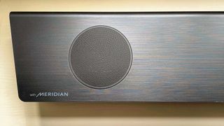 LG S95QR soundbar showing Meridian audio partnership branding