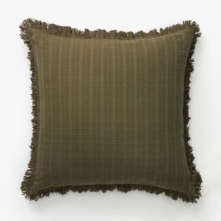 olive green square cushion with frayed edges