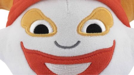 Zoomed in picture of a Balatro Joker plush.