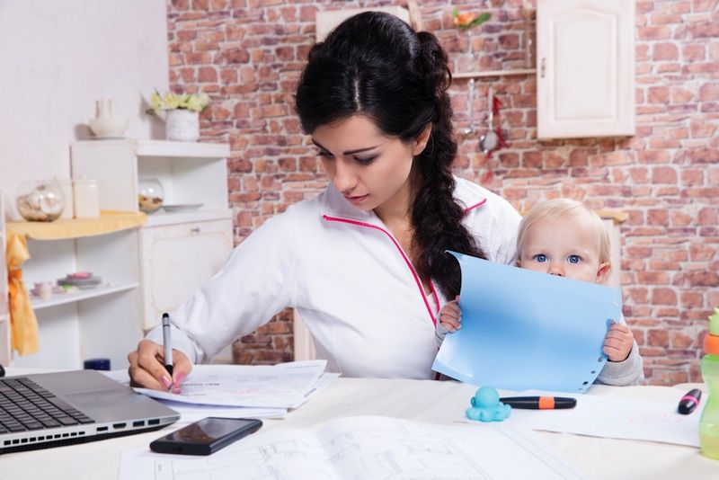 a mom working with baby