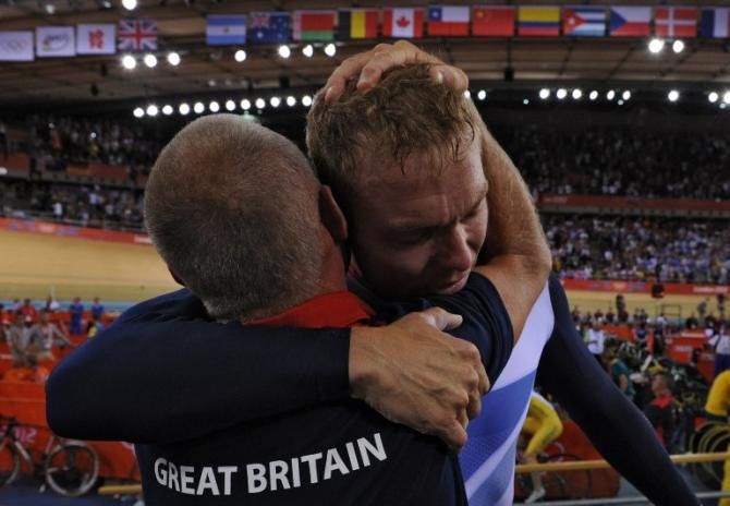 Shane Sutton and Hoy after his final gold medal ride