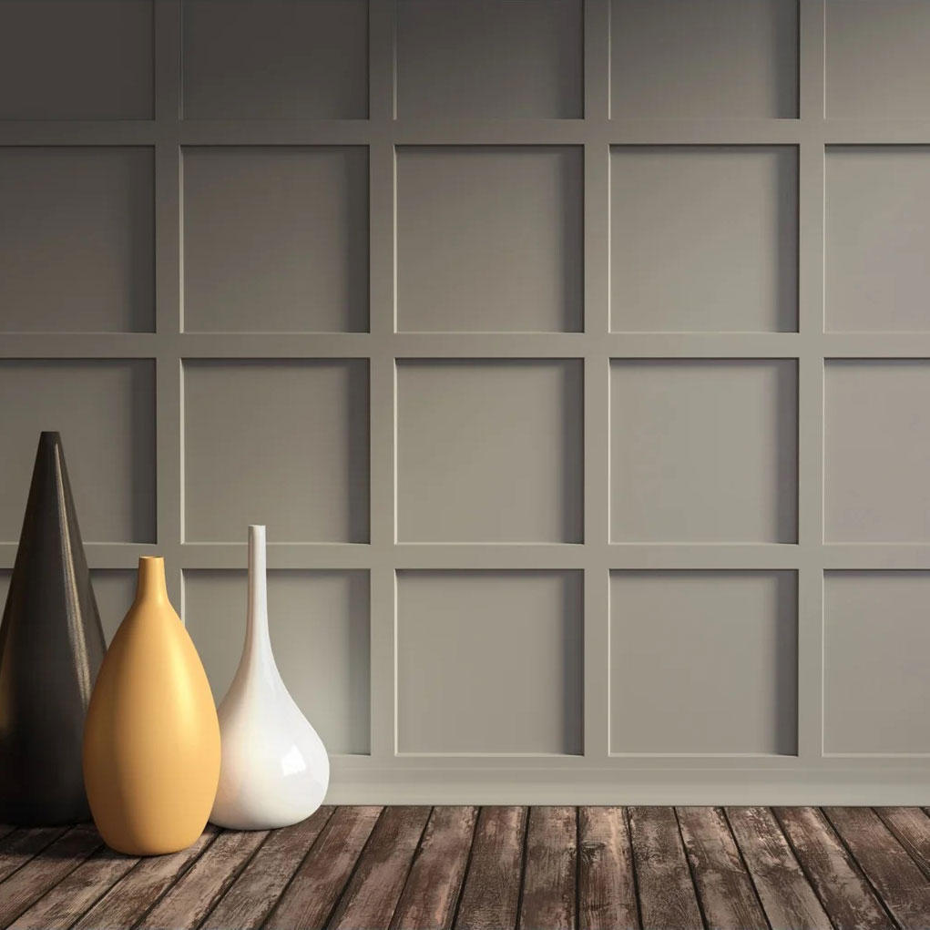 room with wooden flooring and grey wall panelling