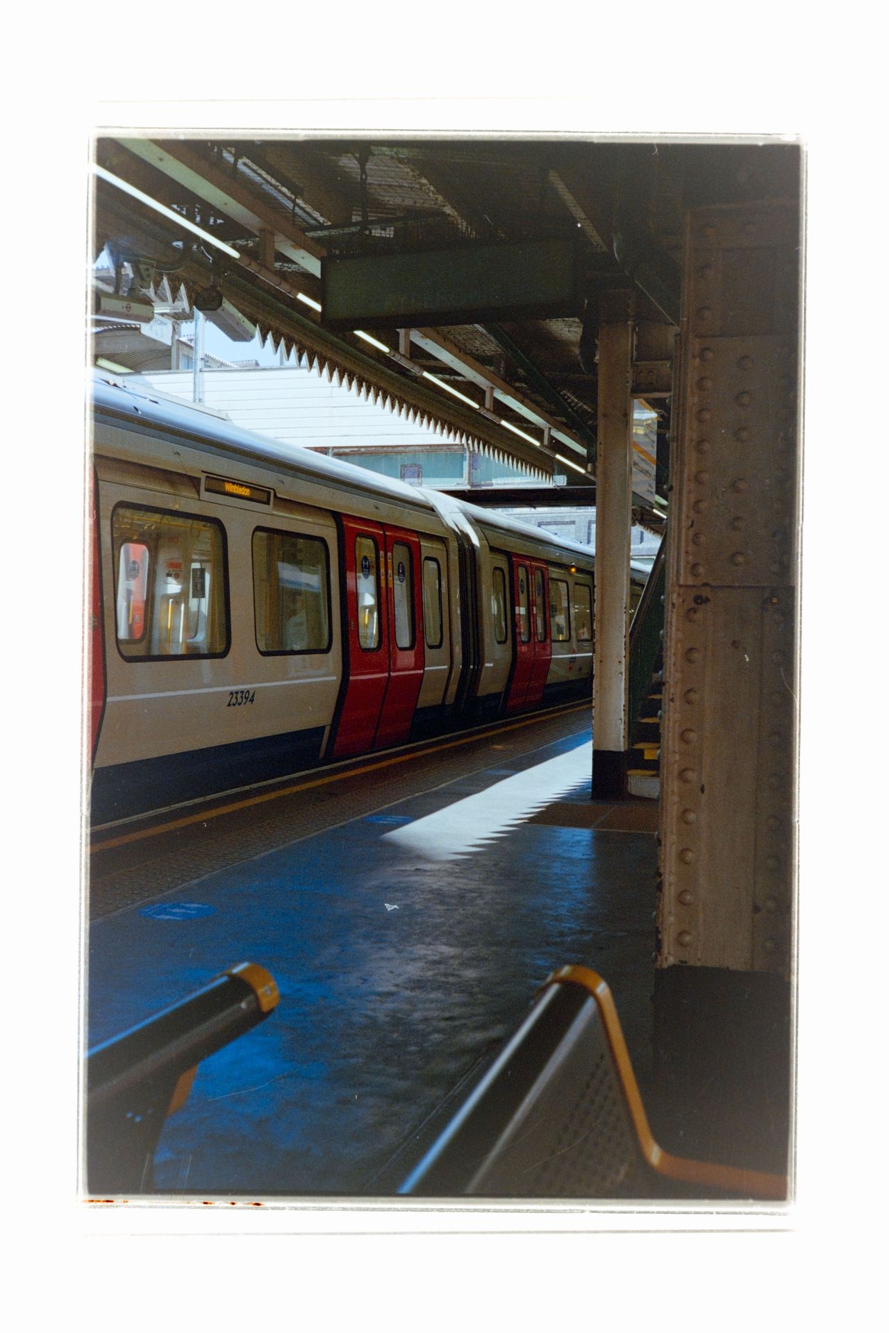 A london Underground train pulling into a station