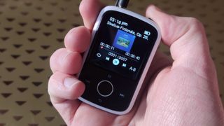 The Majority MP3 Player in a man's hands.