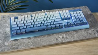 A Redragon Blue Siren K654 wired mechanical keyboard with multi-tone blue keycaps